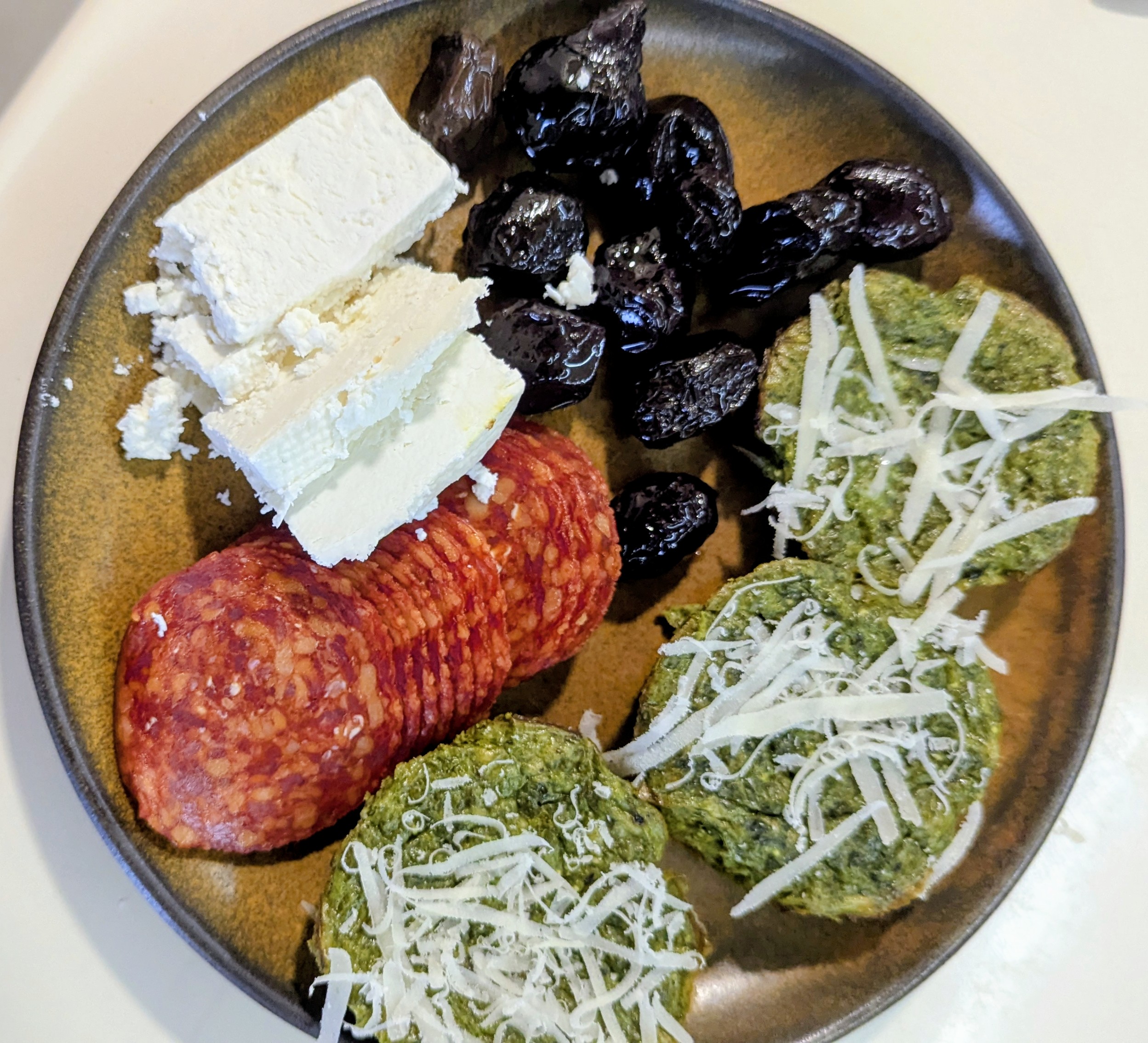 Spinach Cakes with cheese, salami (kulen) and dry olives 